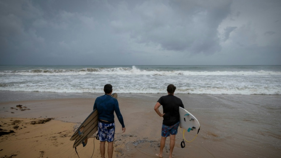 Downgraded Hurricane Erin lashes Caribbean with rain