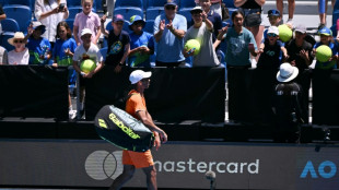 Auger-Aliassime retires in Melbourne heat with cramp
