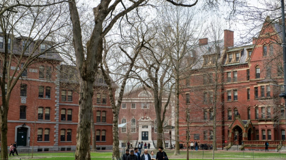 Harvard students march after Trump seeks to cut remaining contracts