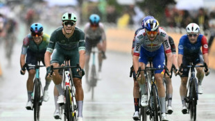 Milan wins crash-marred sprint as Tour approaches Alpine end game