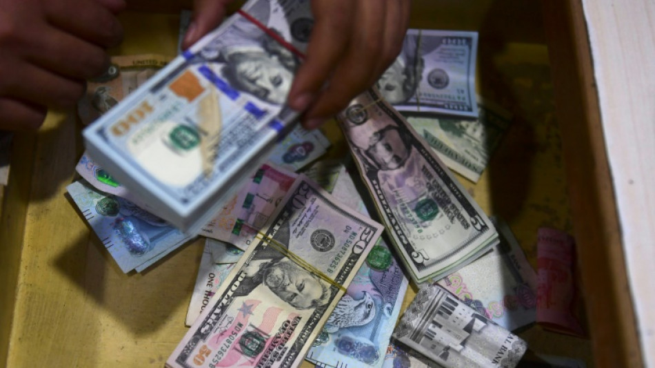 O 'rei d&oacute;lar': criticado e desafiado, mas longe de ser destronado