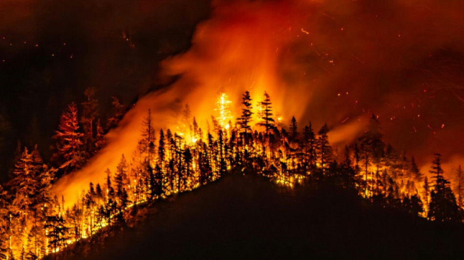 Threat from massive western Canada wildfire eases