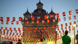 Please don't rush: slow changes in Laos 50 years after communist victory