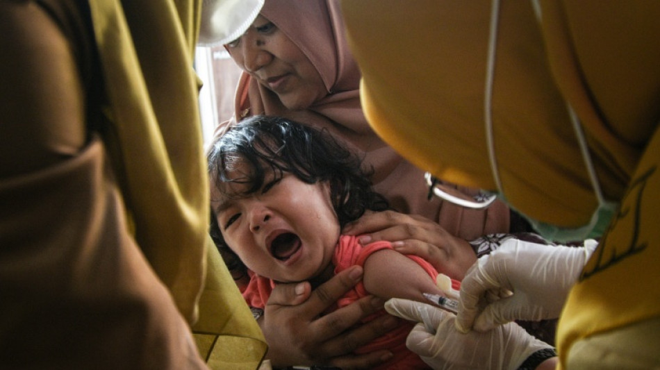 Vitamins over vaccines: misinformation entrenched amid Indonesia measles surge