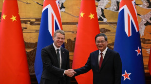 New Zealand PM scores trade deals on China trip