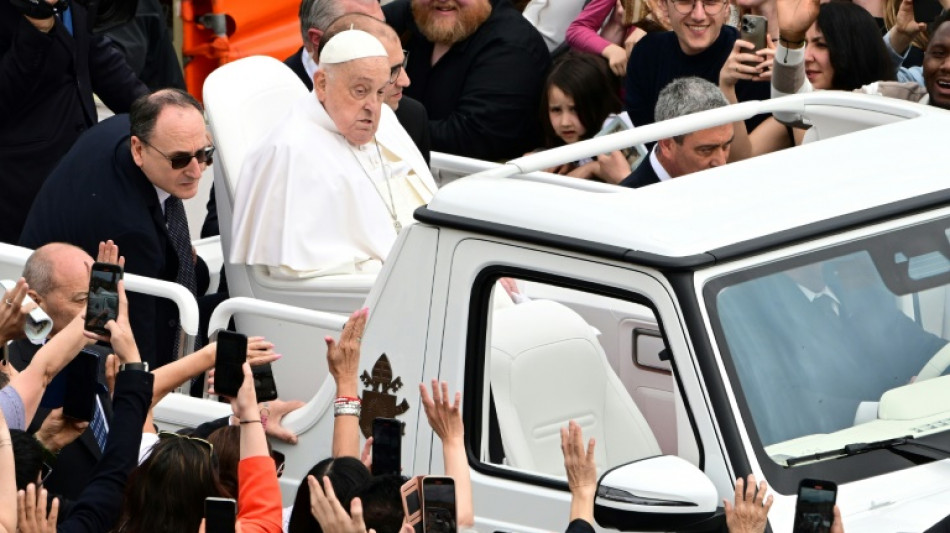 Frail Pope Francis takes to popemobile to greet Easter crowd 