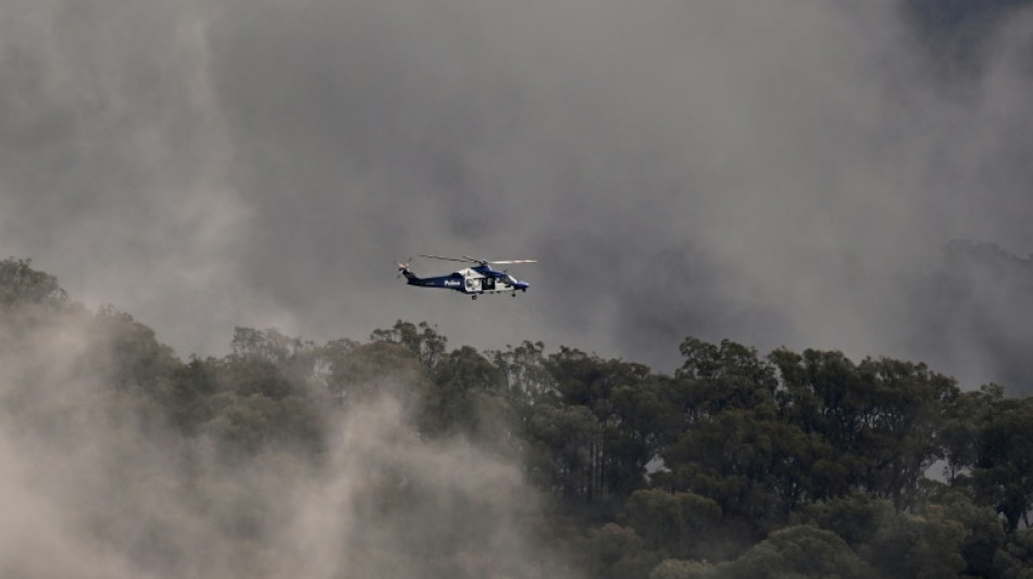 Gunman still at large after Australian police killings