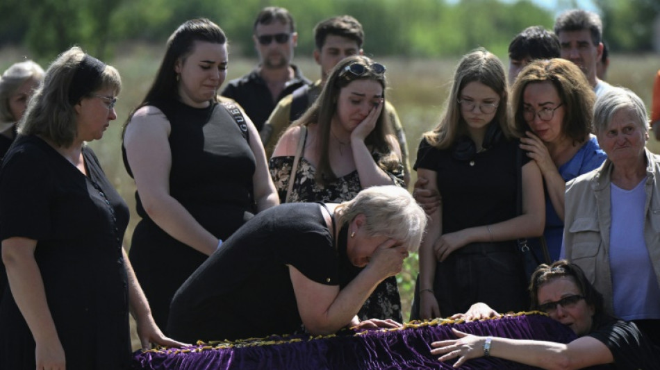 'Back home': family who fled front buried after Kyiv strike