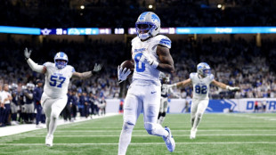 Gibbs runs for three TDs as Lions down Cowboys to boost NFL playoff bid